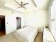 Bright bedroom featuring a ceiling fan, large window, walk in closet, and a neutral color palette at 325 E Paces Ferry Ne Rd # 1606, Atlanta, GA 30305