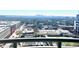 Stunning cityscape view from balcony of lush green city with clear blue skies and distant mountain range at 325 E Paces Ferry Ne Rd # 1606, Atlanta, GA 30305