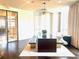 Bright dining area with stylish table, artistic lighting, and large windows with sheer curtains at 325 E Paces Ferry Ne Rd # 1606, Atlanta, GA 30305