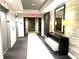 Hallway with elevator access, console table, lighting, mirror, and decor at 325 E Paces Ferry Ne Rd # 1606, Atlanta, GA 30305