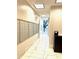 Long hallway features a wall of mailboxes and tiled floor at 325 E Paces Ferry Ne Rd # 1606, Atlanta, GA 30305