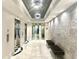 Hallway with elevators, textured wall, and recessed lighting in a modern building at 325 E Paces Ferry Ne Rd # 1606, Atlanta, GA 30305