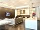 Open kitchen/lounge area featuring white cabinets, island seating, modern appliances and seating at 325 E Paces Ferry Ne Rd # 1606, Atlanta, GA 30305