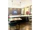 Open kitchen/lounge area featuring dark cabinets, island seating, and modern appliances at 325 E Paces Ferry Ne Rd # 1606, Atlanta, GA 30305