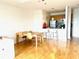 Bright living room featuring an open-concept kitchen, dining table, and modern fixtures with light hardwood floors at 325 E Paces Ferry Ne Rd # 1606, Atlanta, GA 30305