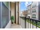 Cozy balcony features wrought iron railings and views of the manicured street at 513 Broadview Ln, Atlanta, GA 30324