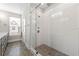 Modern bathroom featuring a glass-enclosed shower and stylish gray vanity with marble countertops at 513 Broadview Ln, Atlanta, GA 30324