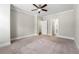 Large bedroom featuring plush carpeting, a ceiling fan, and neutral walls and trim at 513 Broadview Ln, Atlanta, GA 30324