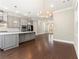 Well-equipped kitchen with stainless steel appliances, gray cabinetry, a center island, and hardwood floors at 513 Broadview Ln, Atlanta, GA 30324