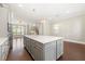 Well-designed kitchen with a large island, stainless steel appliances, and gray cabinetry at 513 Broadview Ln, Atlanta, GA 30324