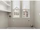 Bright laundry room featuring washer/dryer hookups and window with natural light at 513 Broadview Ln, Atlanta, GA 30324
