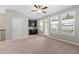 Spacious living room with natural light, carpet floors, a wet bar, and access to a balcony with a view at 513 Broadview Ln, Atlanta, GA 30324
