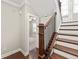 A wood staircase leads to the upper level, providing access to additional bedrooms, offering functional elegance at 513 Broadview Ln, Atlanta, GA 30324