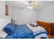 Comfortable bedroom with ceiling fan and ample storage with dresser at 3016 Ansley Manor Ct, Snellville, GA 30078