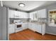 Traditional-style kitchen with white cabinetry, granite countertops and stainless steel appliances at 3016 Ansley Manor Ct, Snellville, GA 30078