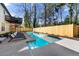 Beautiful backyard featuring a swimming pool, lounge chairs, and a fenced-in yard at 1230 Newbridge Ne Trce, Brookhaven, GA 30319