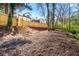 Large backyard with privacy fence and stairs leading up to the house at 1230 Newbridge Ne Trce, Brookhaven, GA 30319