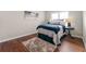 Cozy bedroom with natural light, dark wood floors and simple decor at 1230 Newbridge Ne Trce, Brookhaven, GA 30319