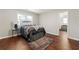Comfortable bedroom featuring hardwood floors and a view to another room at 1230 Newbridge Ne Trce, Brookhaven, GA 30319