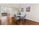 Cozy dining area with a marble table, modern chairs, and beautiful hardwood flooring throughout the room at 1230 Newbridge Ne Trce, Brookhaven, GA 30319