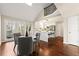 Inviting dining area featuring hardwood floors, a kitchen view, and ample natural light at 1230 Newbridge Ne Trce, Brookhaven, GA 30319