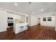 Open-concept kitchen featuring stainless steel appliances, a center island, and hardwood floors at 1230 Newbridge Ne Trce, Brookhaven, GA 30319