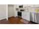 Updated kitchen with stainless steel appliances, white cabinets, and backsplash tiling at 1230 Newbridge Ne Trce, Brookhaven, GA 30319