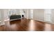 Sun-drenched living room featuring hardwood floors, a fireplace, and bright white trim at 1230 Newbridge Ne Trce, Brookhaven, GA 30319