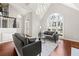 Open-concept living area with a high ceiling, complemented by hardwood floors and a cozy seating arrangement at 1230 Newbridge Ne Trce, Brookhaven, GA 30319