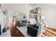 Spacious open-concept living room with hardwood floors, fireplace, staircase, and abundant natural light at 1230 Newbridge Ne Trce, Brookhaven, GA 30319