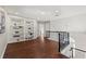 Loft area featuring a custom bookcase and hardwood floors, providing a stylish and functional space at 1230 Newbridge Ne Trce, Brookhaven, GA 30319