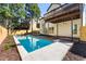 Inviting backyard with a sparkling pool, complemented by lounge chairs and lush greenery at 1230 Newbridge Ne Trce, Brookhaven, GA 30319