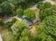 Aerial view of a home surrounded by lush trees in a neighborhood setting, highlighting the property's location at 1321 Bridges Sw Ave, Atlanta, GA 30310