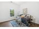 Stylish bedroom with patterned rug, plush bedding and natural light from window at 1321 Bridges Sw Ave, Atlanta, GA 30310