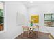 Cozy dining area featuring a round table and wicker chairs near a bright window at 1321 Bridges Sw Ave, Atlanta, GA 30310