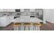 Well-appointed kitchen showcasing a large island, stainless steel appliances, and stylish backsplash at 1321 Bridges Sw Ave, Atlanta, GA 30310