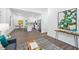 Open-concept living area with views of the modern kitchen and adjacent dining space at 1321 Bridges Sw Ave, Atlanta, GA 30310