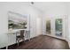 Home office boasts a desk, bright natural light, and access to the backyard through glass doors at 1321 Bridges Sw Ave, Atlanta, GA 30310
