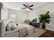 Bedroom featuring a neutral palette, ceiling fan, and a decorative plant at 2584 Oldknow Sw Dr, Atlanta, GA 30318