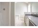Bright bathroom features a modern vanity with gray countertop and white tiled flooring at 2149 Shoals Way, Decatur, GA 30034
