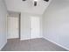 Carpeted bedroom with neutral-colored walls and multiple white doors at 2149 Shoals Way, Decatur, GA 30034