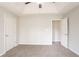 Well-lit bedroom with carpet, tray ceiling and multiple doorways at 2149 Shoals Way, Decatur, GA 30034