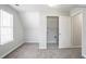 Upstairs bedroom featuring neutral walls and plush carpet, with easy access to a convenient laundry room at 2149 Shoals Way, Decatur, GA 30034
