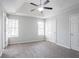 Bright bedroom with carpet, white trim, ceiling fan, and natural lighting at 2149 Shoals Way, Decatur, GA 30034