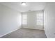 Neutral bedroom with carpet, white walls, and two bright windows at 2149 Shoals Way, Decatur, GA 30034