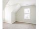Bright bedroom with neutral walls, carpeted floor, and ample natural light from a large window at 2149 Shoals Way, Decatur, GA 30034