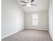 Bedroom features a ceiling fan and window, complemented by neutral-colored walls at 2149 Shoals Way, Decatur, GA 30034