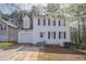 Charming two-story home featuring white siding, black shutters, and an attached garage at 2149 Shoals Way, Decatur, GA 30034