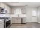 Updated kitchen featuring stainless steel appliances, white subway tile backsplash, and updated cabinetry at 2149 Shoals Way, Decatur, GA 30034