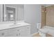Bathroom with a toilet, bathtub and a white vanity at 2393 Strand Ave, Lawrenceville, GA 30043